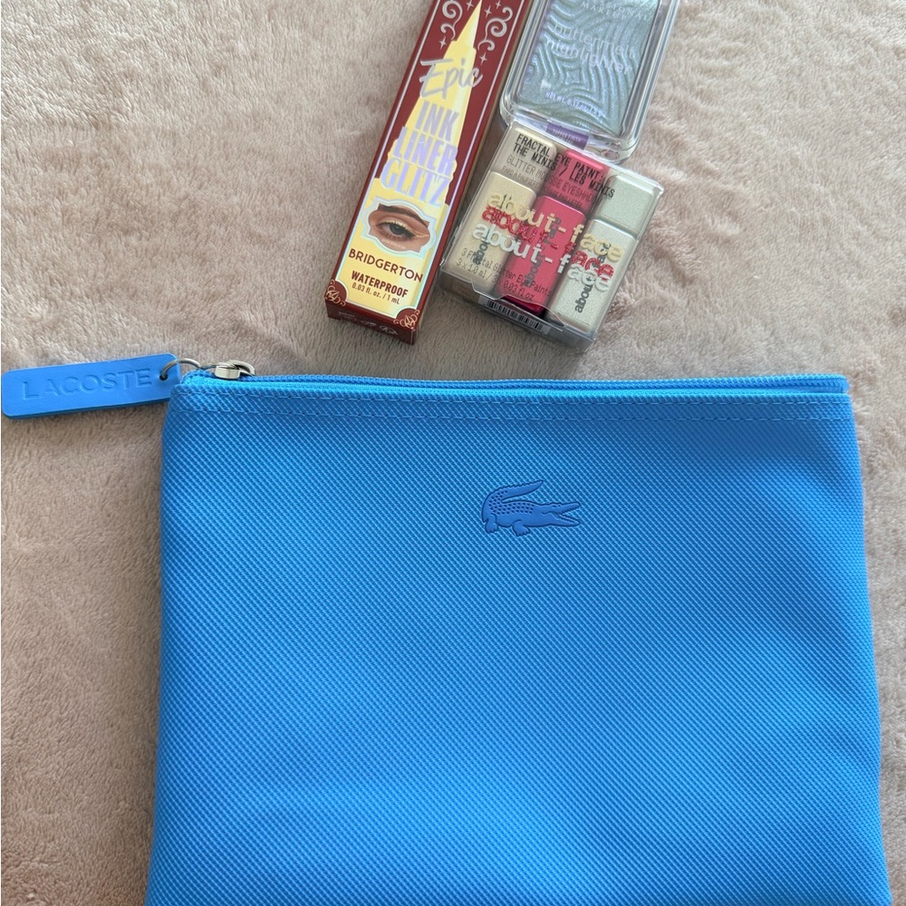 Lacoste Blue Pouch with About Face and NYX makeup products